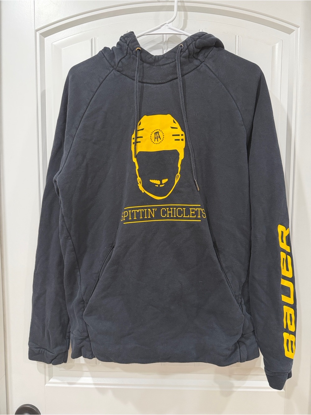 Bauer Black Hoodie with Yellow Helmet Graphic Barstool Sports